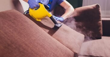 dry-cleaner-s-employee-removing-dirt-from-furniture-flat-closeup-min-1-scaled