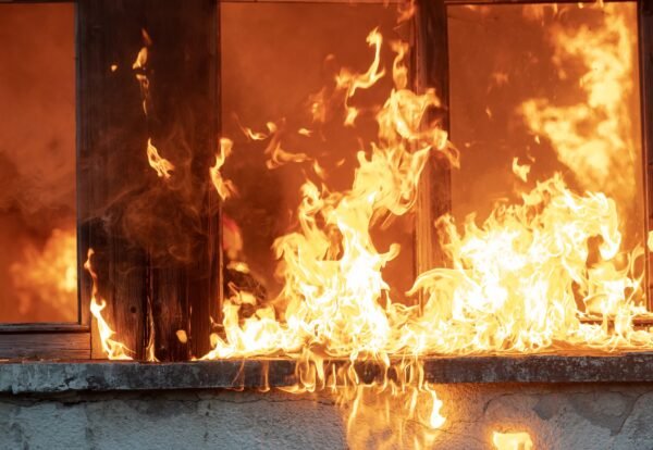 firefighter-hero-carrying-baby-girl-out-from-burning-building-area-from-fire-incident-rescue-people-from-dangerous-place-team-work-high-quality-photo-scaled